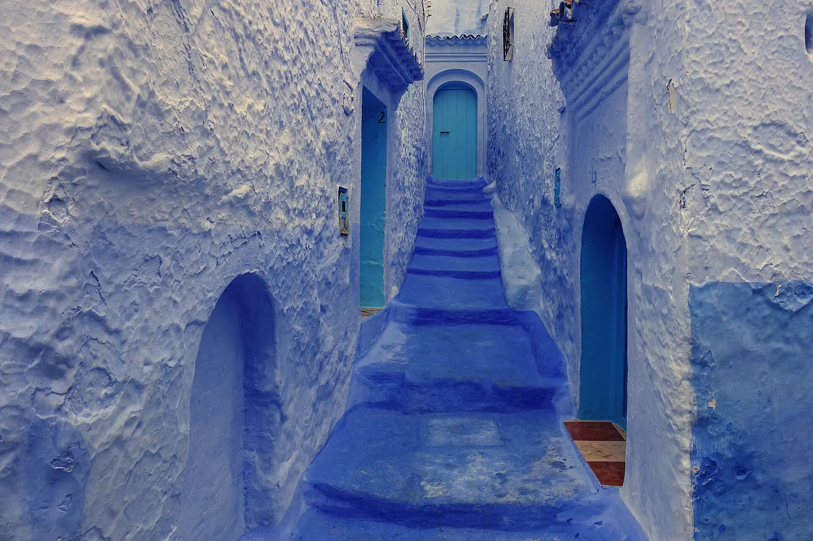 Blue-painted stairway in a Chefchaouen alley