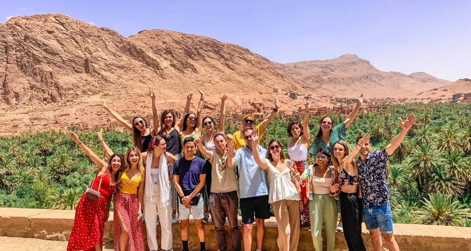 Student group photo at a palm oasis viewpoint in the Dades Valley